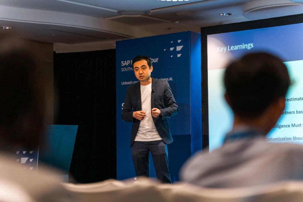 A speaker presenting key learnings at the SAP NOW AI Tour Southeast Asia 2025, with an audience visible in the foreground.
